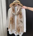 Lightweight leopard and floral print sun protection scarf with an elegant tassel trim - 180cm / Leopard Print and Flowers