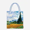 Detailed front view of a canvas tote bag featuring Van Gogh's Wheatfield with Cypresses. - Wheat Field and Cypresses