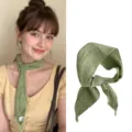 Detailed view of the green ramie skinny scarf with natural fabric texture - 110cm / Green