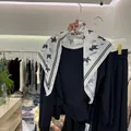 White triangular silk scarf with elegant black pony print for women's versatile styling - Pony Print (Pony Cotton Feel Triangle Scarf) / White