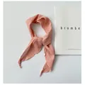 Macro view of pink ramie narrow scarf with delicate wavy edges on white background - 110cm / Pink