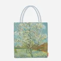 Detail of canvas tote bag featuring Van Gogh's iconic Almond Blossoms oil painting art print. - Pear Tree in Bloom