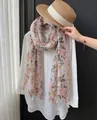 Elegant floral print silk scarf with tassels shown on a white shirt and straw hat - 180cm / Fresh Pink Flower