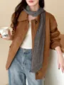 Detailed macro view of a vintage checkered linen scarf worn with a stylish brown jacket - Long Style / 185cm / Navy Small Plaid