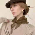 Japanese retro 100% linen floral scarf in olive green, worn as a stylish neck accessory - Linen Triangle Scarf / Olive Green Polka Dot