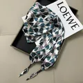 Elegant silk waist scarf featuring black and teal floral patterns with metallic tips - Black and Teal Plant Print with Beads (45)