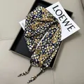 Elegant navy floral silk scarf with yellow patterns, luxurious SKU variant display. - Navy Floral with Rope Tie (Style-46)