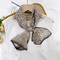 Elegant paisley pattern silk scarf 35x140cm tied on a white dress displayed on a hanger - Brown Small Paisley