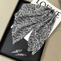 Elegant black and white paisley silk-like triangle scarf for waist styling accessory. - Black and White Paisley with Bead Decor (Style-95)