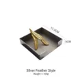 Silver stainless steel square napkin holder with a decorative gold feather weight. - Silver Feather Style