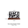 Modern black metal cutout napkin holder featuring a sturdy dark wood base, 14cm width - Hollow Napkin Holder