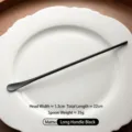 Matte black 304 stainless steel long handle coffee stirring spoon placed on a white ceramic plate - Matte Long Handle (22cm) Black