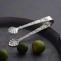 Elegant European style stainless steel food tongs with rose embossing and shell-shaped tips - Gold