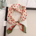 Close-up detail of the retro floral pattern on a pastoral cotton linen neckerchief - 58cm / Red Floral with Green Edge