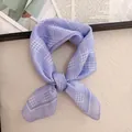 Detailed macro shot of a purple checkered cotton linen square scarf tied in a knot style - 58cm / Purple and White Plaid