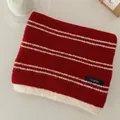 Close-up detail of a vintage red and white striped knit scarf featuring a woven logo label - 160cm/Pack / Double Fine Stripes