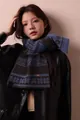 Close-up of a warm Fair Isle snowflake jacquard wool blend scarf on a model. - 170cm / Coffee Blue