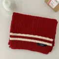 Detailed view of red cable knit scarf featuring white stripes and a navy OURME brand label. - 160cm/Pack / Twisted Stripe
