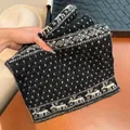 Cozy winter knitted scarf with snowflake and reindeer patterns in black and white - Black