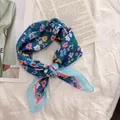 Close-up of blue floral square scarf with small pink and yellow flowers on white background - 58cm / Blue Fresh Flowers