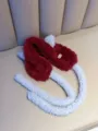 Close-up of cute burgundy cat ear earmuffs with soft lambswool texture and long straps. - One Size / Red
