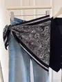Chic black and white paisley print triangular scarf used as a stylish waist accessory - Retro Black Paisley