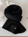 Close-up of a soft 100% wool fine knit scarf in classic black on a white shirt - 144cm / Dusk Black