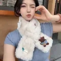 Macro view of a cute cream plush bear scarf with a white lace bow for winter warmth - Apricot / 92cm