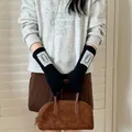 Stylish women's black knitted long gloves featuring delicate lace trim for winter warmth - One Size / Black