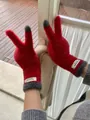 Close-up of red coral fleece touchscreen gloves with grey faux fur trim and labels - One Size / Christmas Red