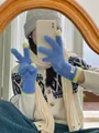 Detailed view of blue coral fleece touchscreen gloves worn in a cozy mirror selfie. - One Size / Sky Blue