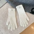 Detailed view of white 100% merino wool knitted gloves with very soft texture - One Size / White
