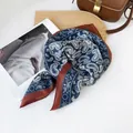 Detail of navy blue and brown paisley cotton linen square scarf on wooden board. - RZ6554-Blue