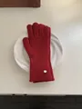 Solid color knitted wool winter gloves in red with a decorative metal tag detail - Gloves / Red
