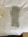 Elegant grey knitted winter gloves for women with a minimalist metal logo tag detail - Gloves Only / Gray