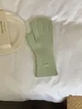Light green knitted winter gloves with a minimalist oval metal logo plate detail. - Gloves Only / Apple Green