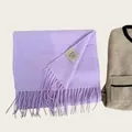 High-quality close-up showing the 100% Australian wool label on a lavender scarf - Smoky Purple