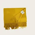 Detail shot of 100% Australian wool scarf with fringed edges in vibrant yellow - Ginger Yellow