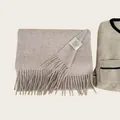 Detailed close-up of 100% Australian wool scarf label showing soft fabric texture - Dusty Mauve