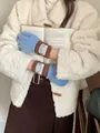 Close-up of sweet retro five-finger wool knit gloves in blue and brown winter style - One Size / Blue and Brown Edge