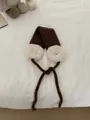Warm winter plush ear warmers with tie-on straps in stylish brown and white finish - One Size / Coffee