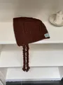 Cozy brown knitted earflap hat with braids for autumn and winter warmth - One Size / Caramel Brown