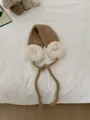 Warm brown and white knitted plush earmuffs with cozy adjustable tie straps for women - One Size / Camel