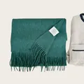 Premium 100% Australian wool scarf in deep green featuring soft tassels and care label - Dark Green