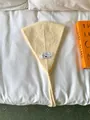 Retro cream knit ear warmer headband with adjustable tie-straps and fabric patch label - One Size / Creamy Yellow
