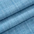 Tessuto tweed azzurro con paillettes per abbigliamento di alta qualità e fai da te. - Celeste