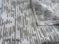 Close-up view of light grey chenille jacquard fabric with vertical textured pattern - Light Gray
