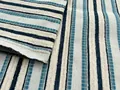 Close-up detail of jacquard striped chenille fabric in cream, teal, and navy - Blue and Dark Blue