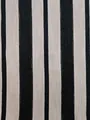 Close-up of black and beige vertical striped chenille fabric for upholstery and bags. - Black