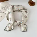 Detail view of a vintage floral cotton square scarf with delicate daisy print and lace trim - Small Bouquet Beige / 68*68cm
